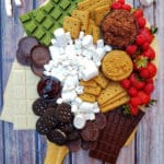 S'Mores charcuterie board arranged on a wooden table top background form the top-down